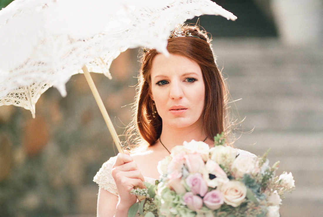 bride with a parasol in bright light